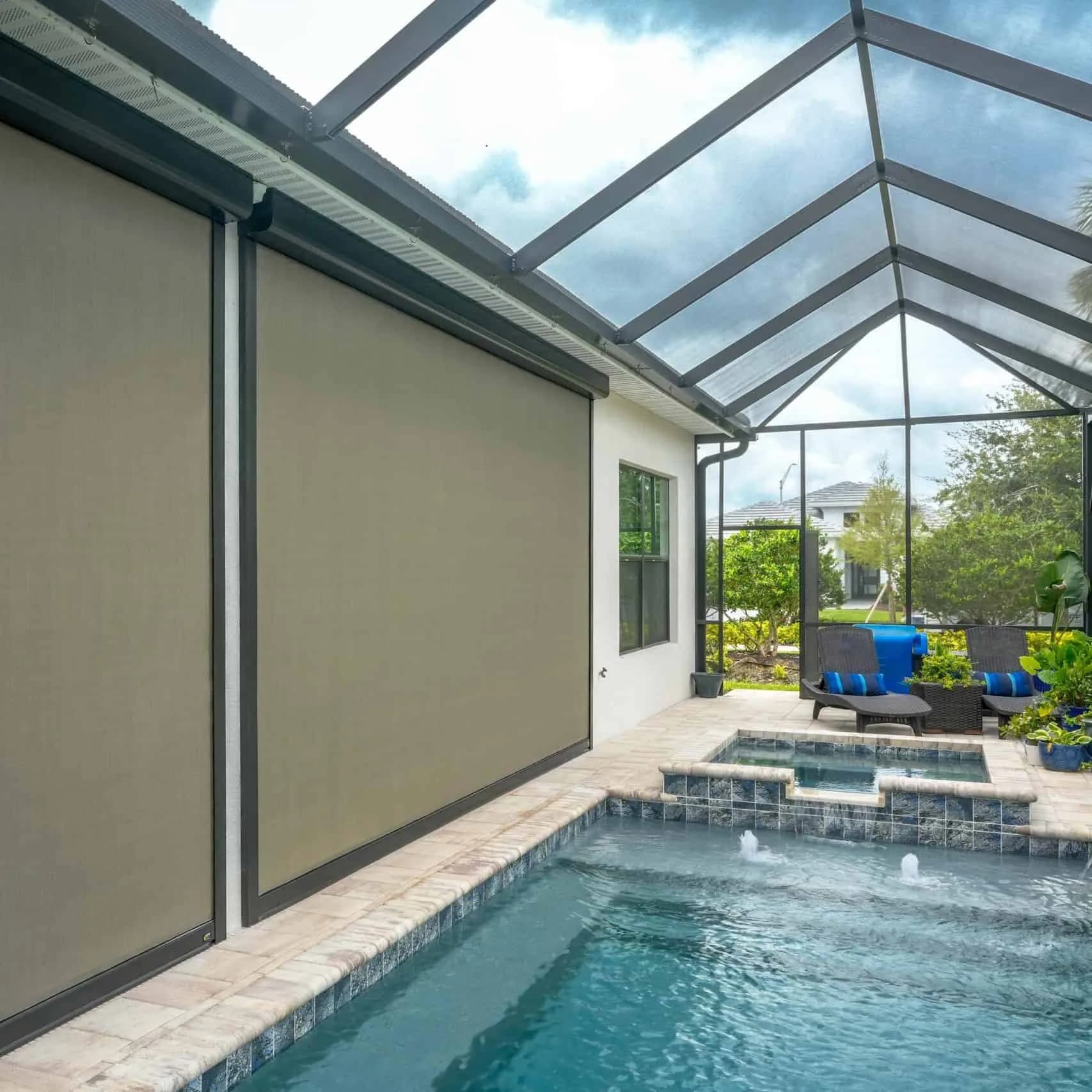 Motorized patio screens lowered under a cedar pergola at a Houston home